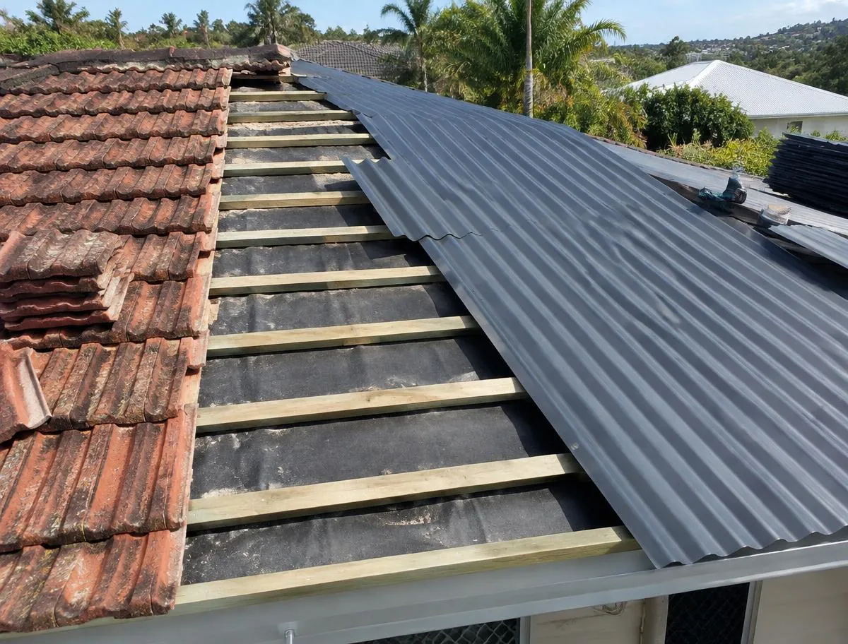 Roof part-way through a tile to metal conversion with new battens and corrugated sheeting